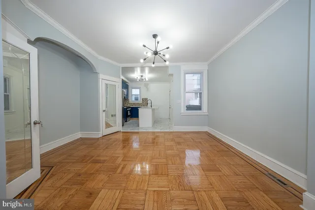 a view of an empty room with a fireplace