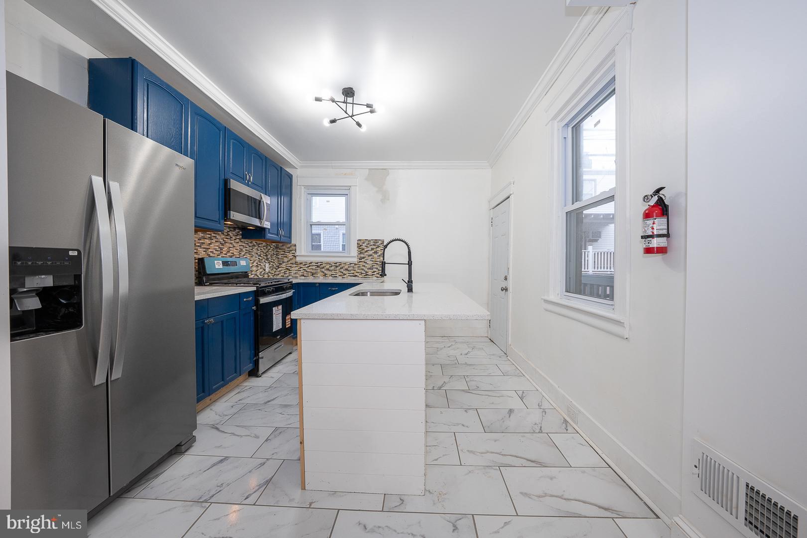 212 Copley Road Upper Darby, PA 19082 - Photo 16 of 69 a kitchen with stainless steel appliances a refrigerator sink and cabinets