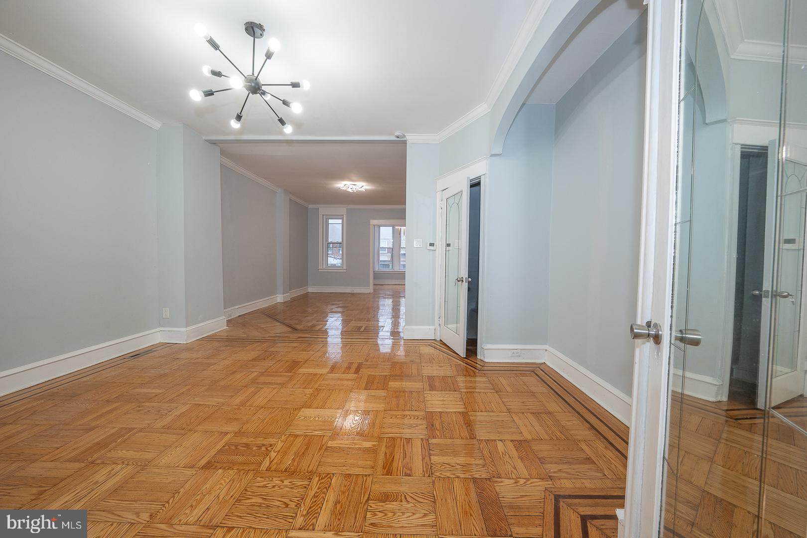 212 Copley Road Upper Darby, PA 19082 - Photo 23 of 69 a view of a big room with closet and chandelier fan