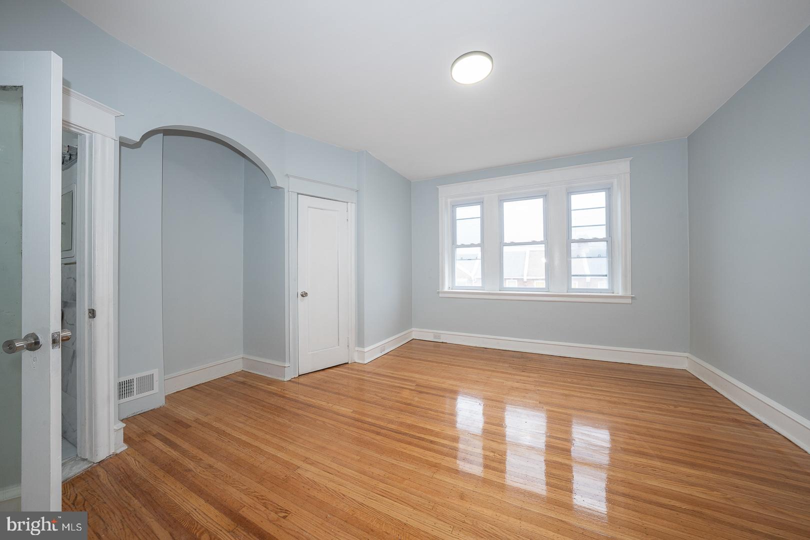 212 Copley Road Upper Darby, PA 19082 - Photo 27 of 69 a view of empty room with wooden floor and fan