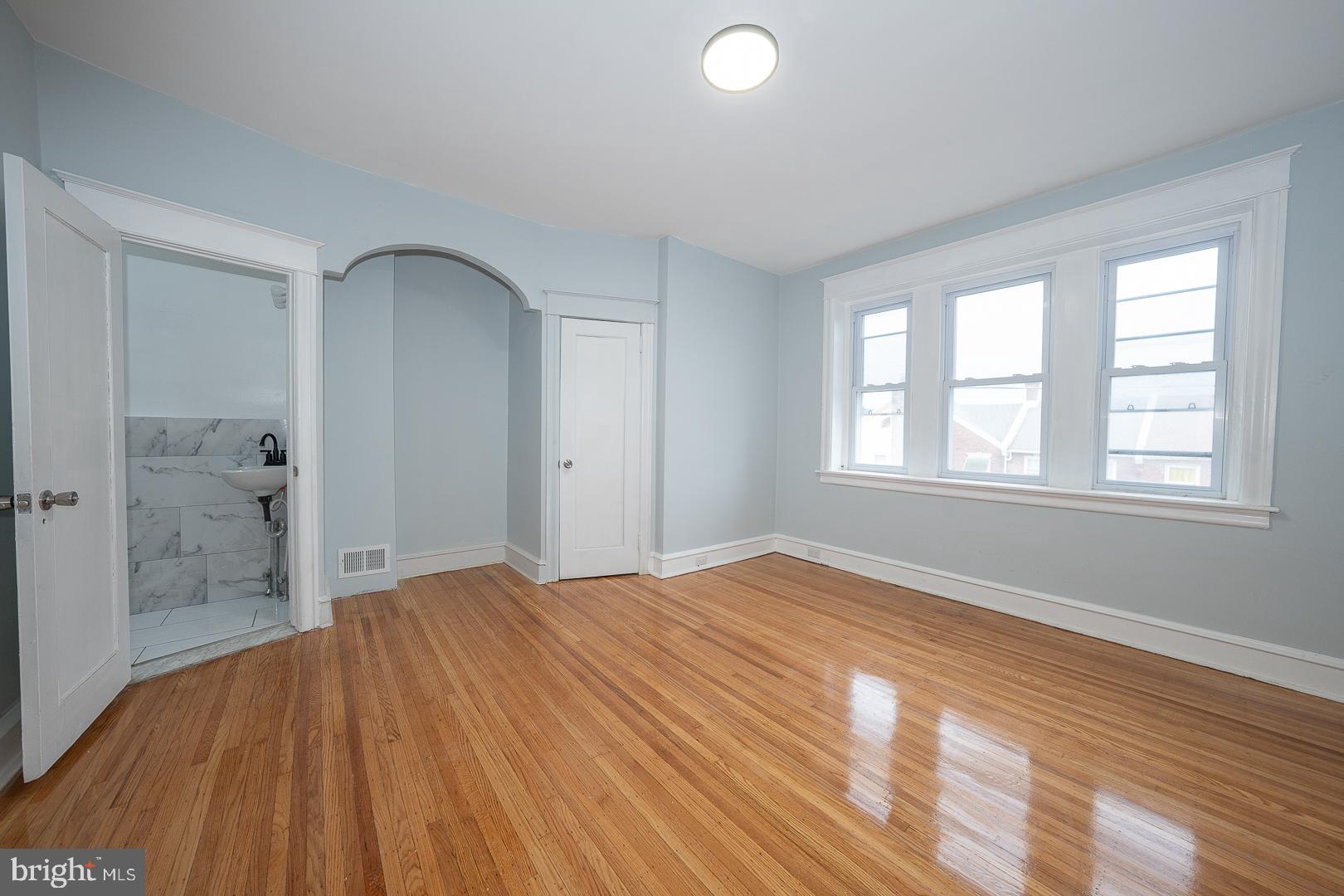 212 Copley Road Upper Darby, PA 19082 - Photo 29 of 69 a view of empty room with wooden floor and fan