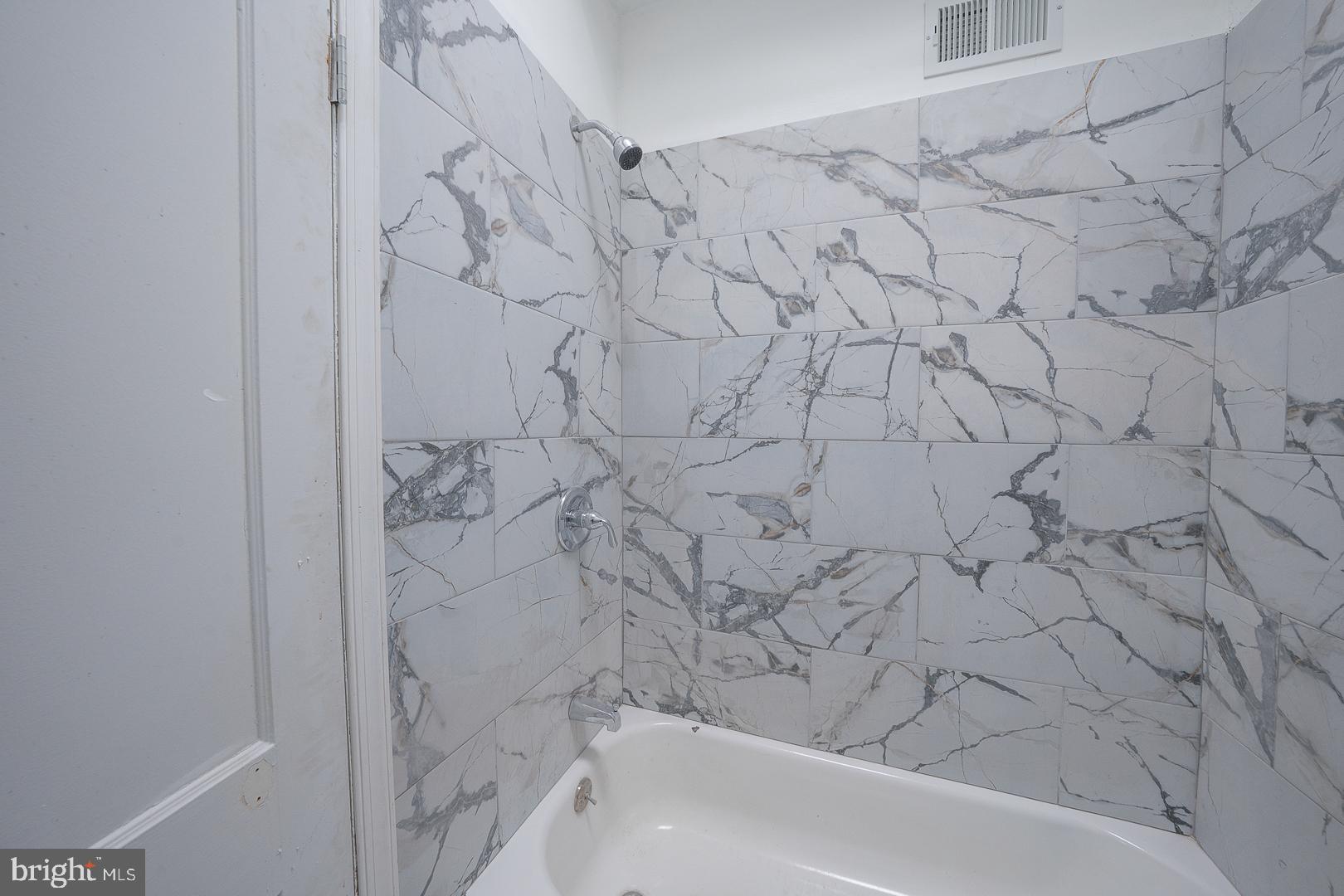 212 Copley Road Upper Darby, PA 19082 - Photo 40 of 69 a bathroom with a bathtub