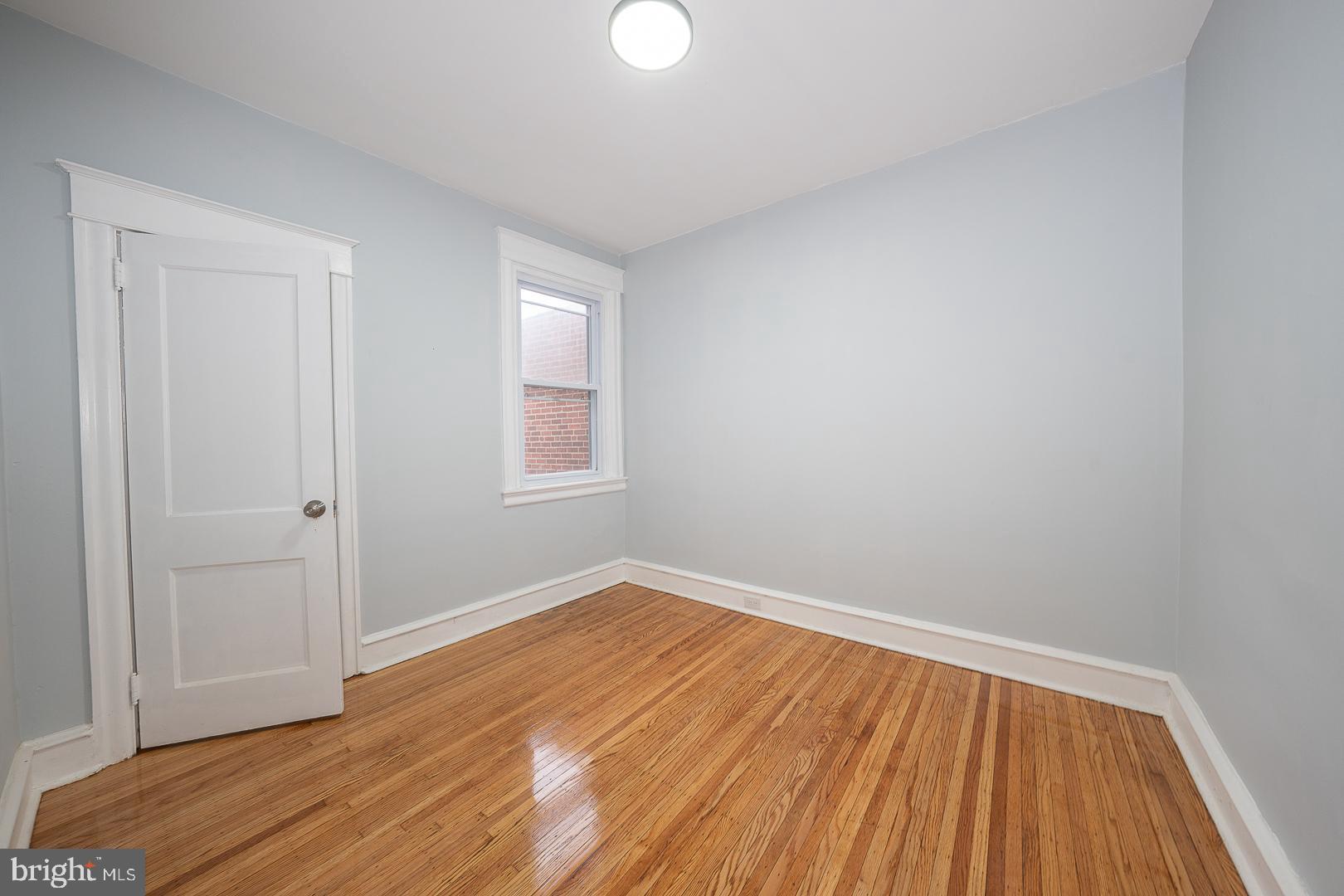 212 Copley Road Upper Darby, PA 19082 - Photo 41 of 69 a view of room with window and wooden floor