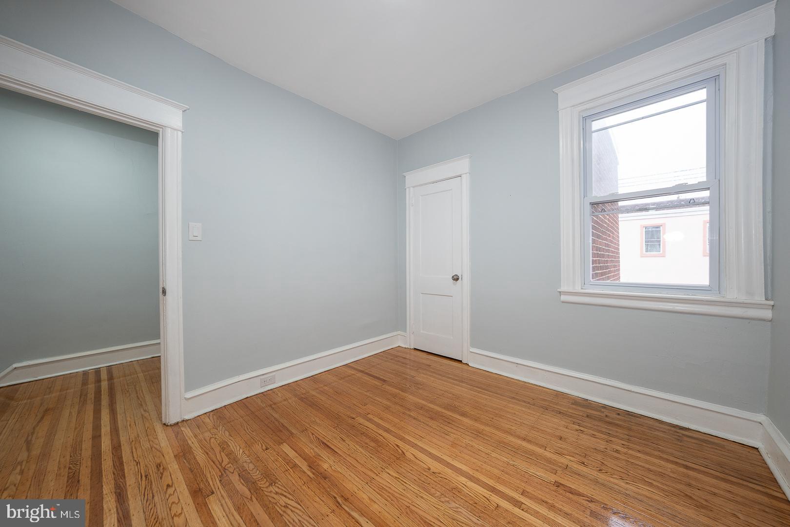 212 Copley Road Upper Darby, PA 19082 - Photo 44 of 69 an empty room with wooden floor and windows