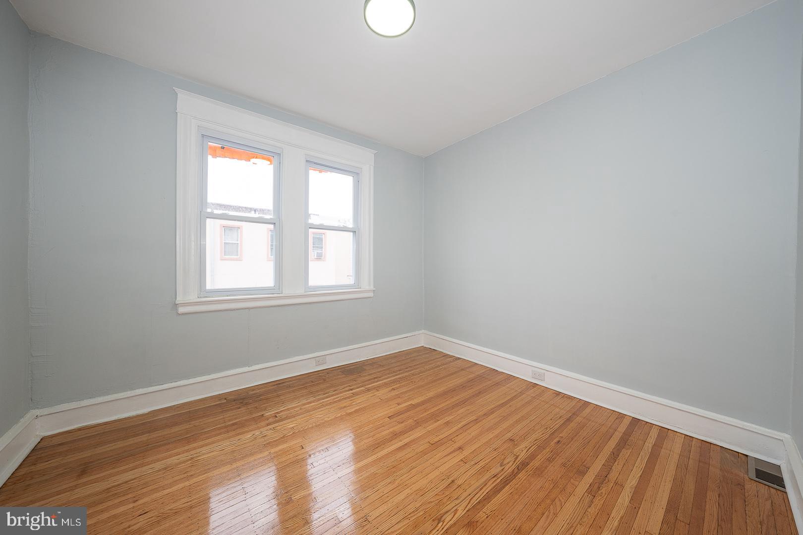 212 Copley Road Upper Darby, PA 19082 - Photo 45 of 69 wooden floor in an empty room with a window