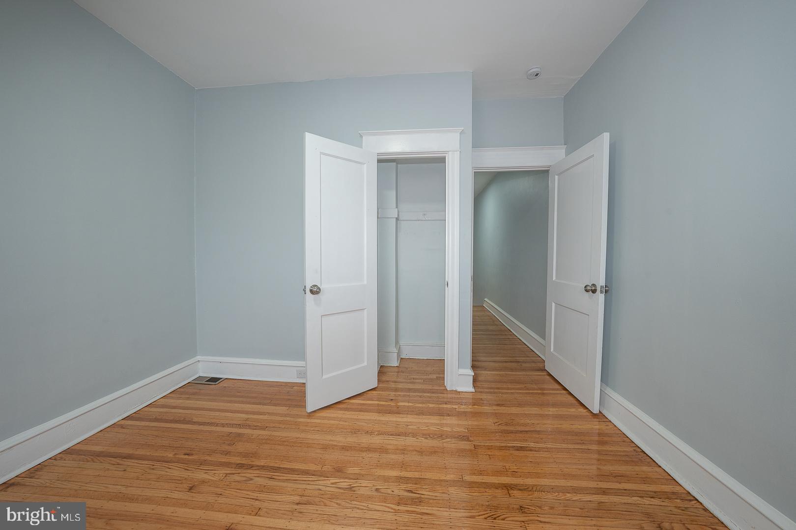 212 Copley Road Upper Darby, PA 19082 - Photo 46 of 69 a view of an empty room with wooden floor