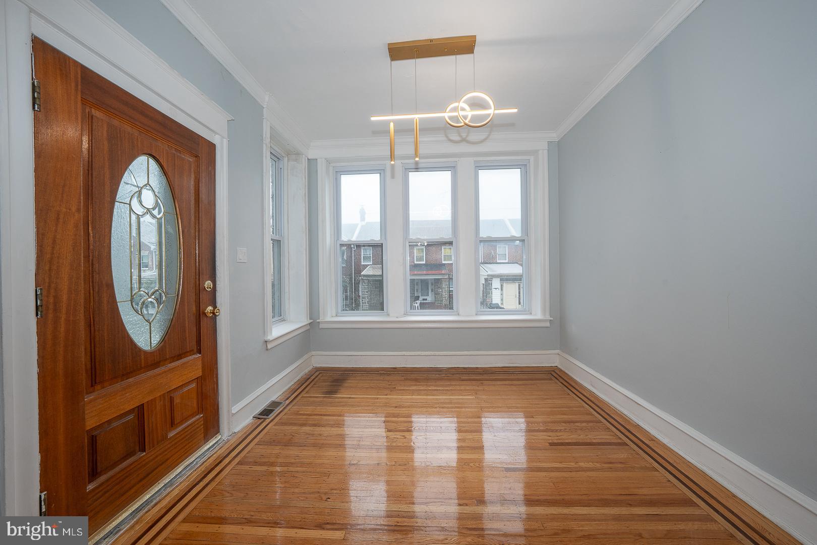 212 Copley Road Upper Darby, PA 19082 - Photo 5 of 69 a view of empty room with wooden floor and fan