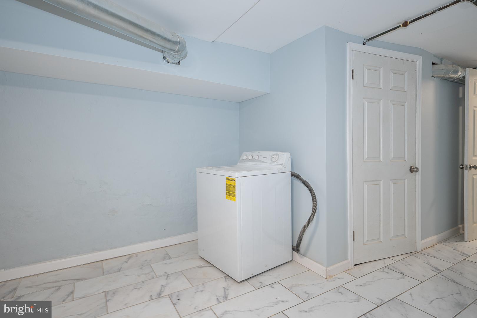 212 Copley Road Upper Darby, PA 19082 - Photo 51 of 69 a view of a storage & utility room with washer and dryer