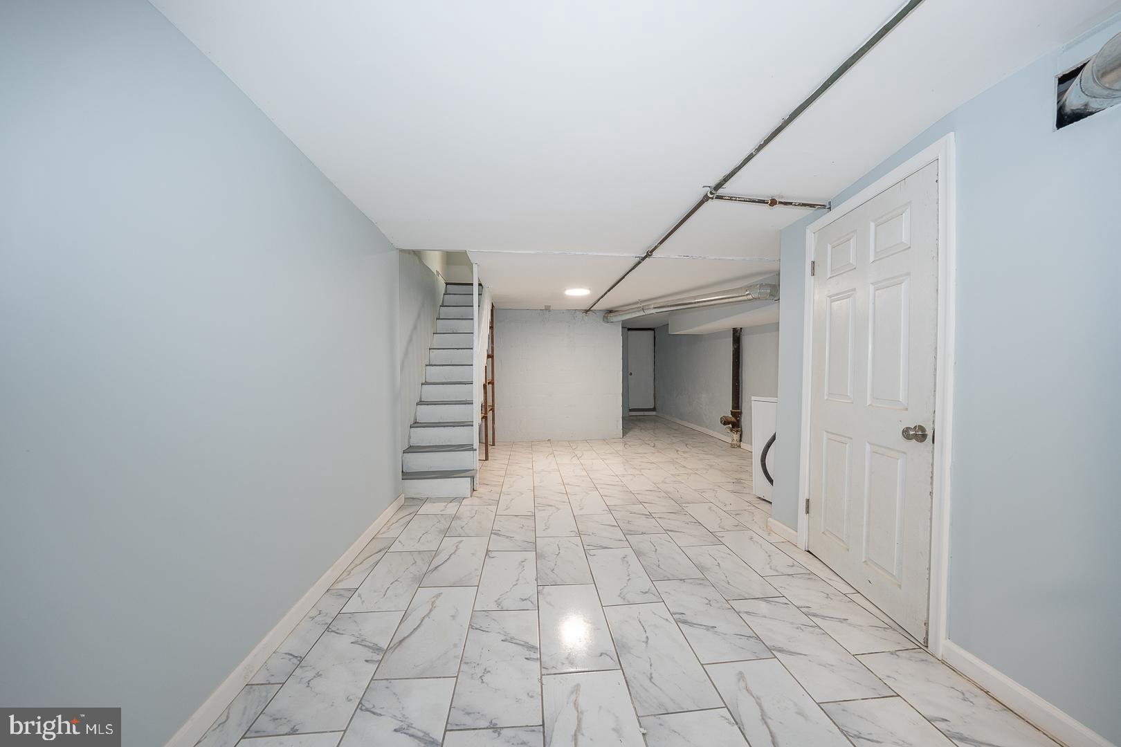 212 Copley Road Upper Darby, PA 19082 - Photo 54 of 69 a view of a hallway with stairs and a window