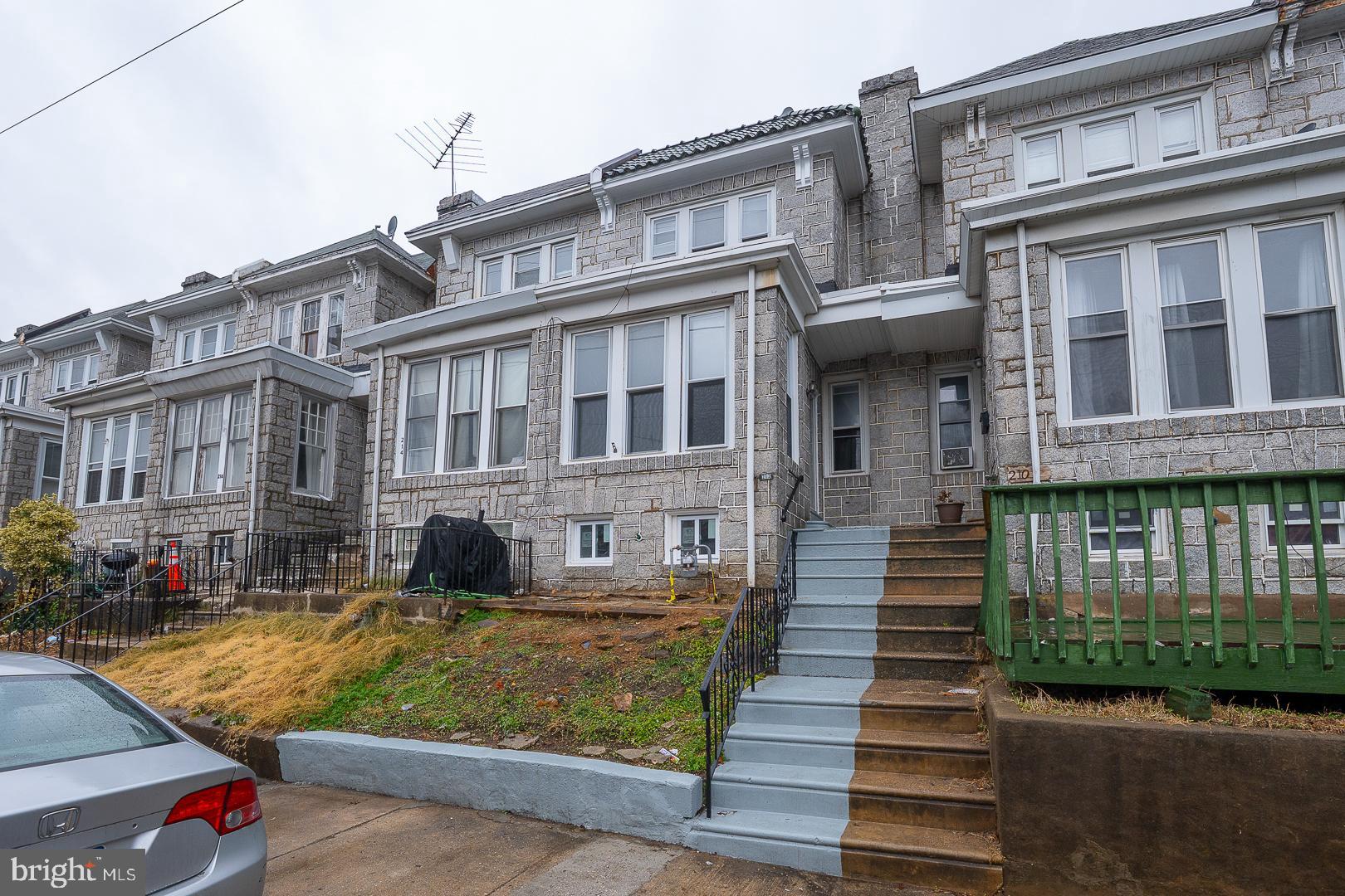 212 Copley Road Upper Darby, PA 19082 - Photo 66 of 69 a front view of a house with a yard
