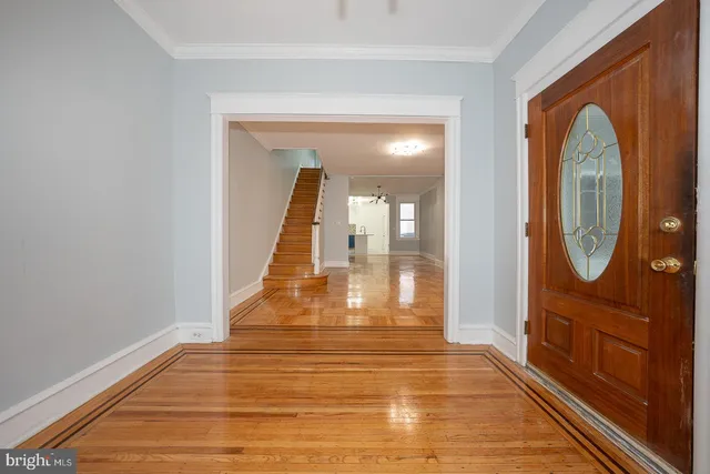 a view of a entryway door with wooden floor
