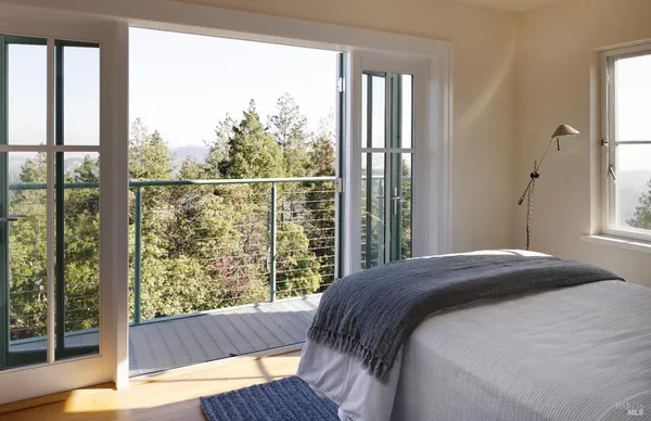 a bedroom with a bed and a table