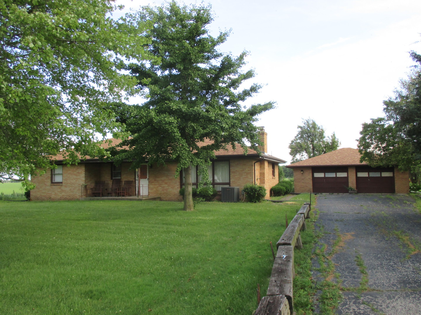 248 North 2550th Road Peru, IL 61354 - Photo 1 of 15 a front view of a house with yard