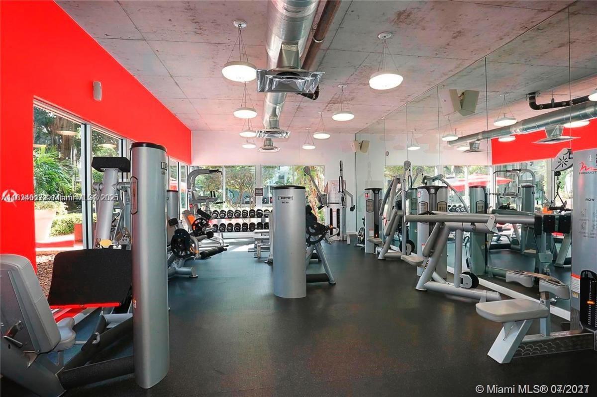 680 Northeast 64th Street, Unit A501 Miami, FL 33138 - Photo 21 of 30 a view of a room with gym equipment