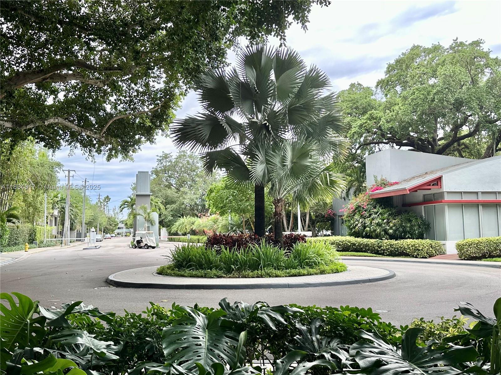 680 Northeast 64th Street, Unit A501 Miami, FL 33138 - Photo 3 of 30 a view of street with houses and trees