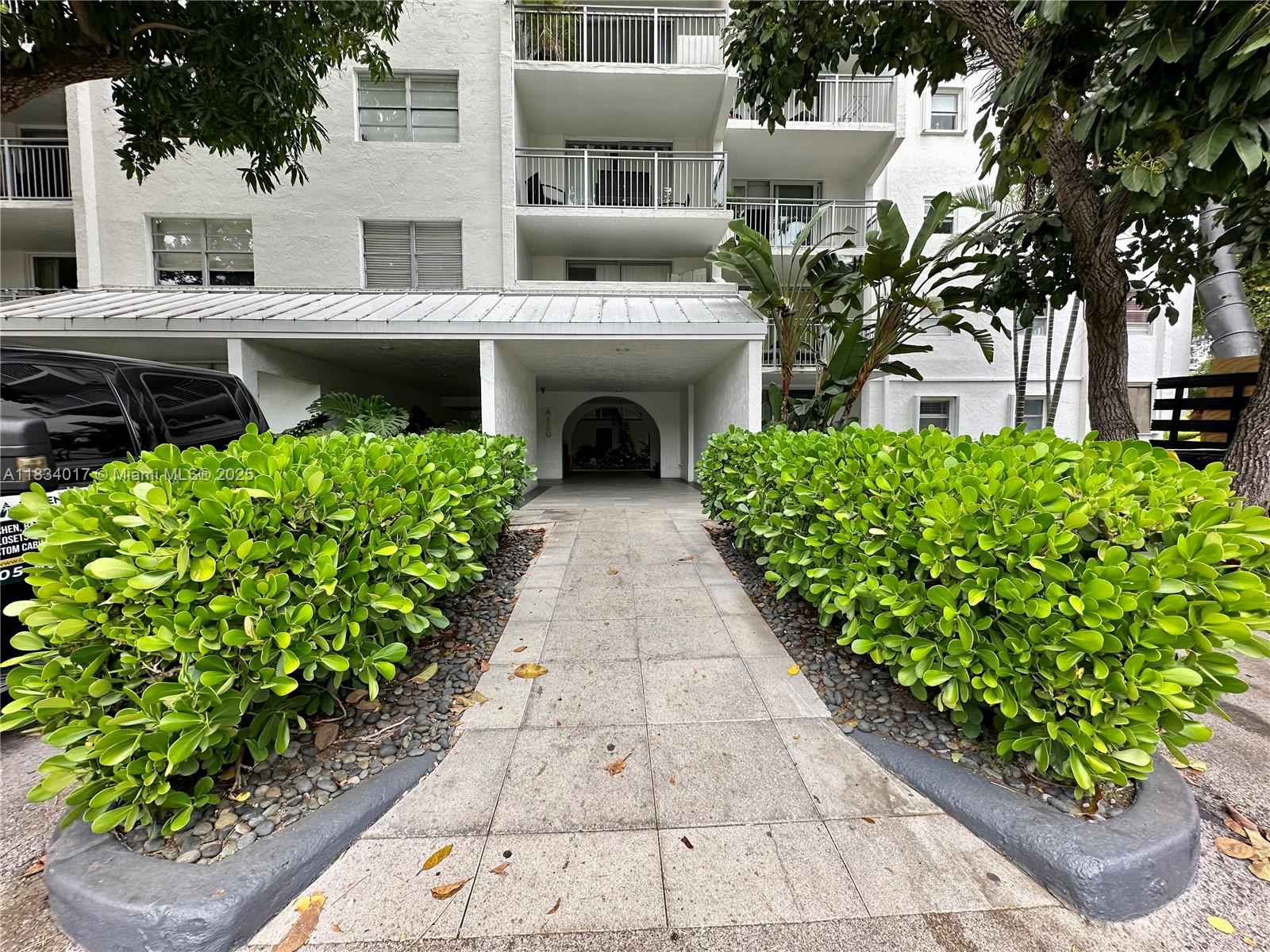 680 Northeast 64th Street, Unit A501 Miami, FL 33138 - Photo 4 of 30 a front view of a house with garden