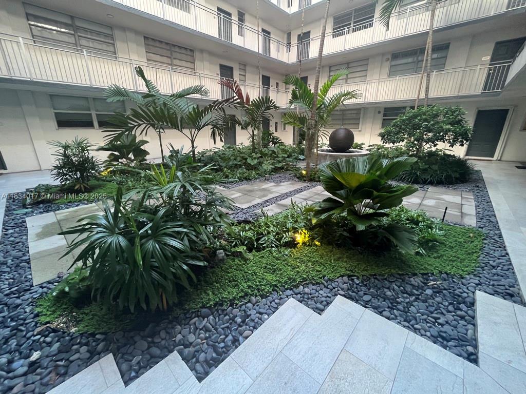 680 Northeast 64th Street, Unit A501 Miami, FL 33138 - Photo 5 of 30 a front view of a house with a yard