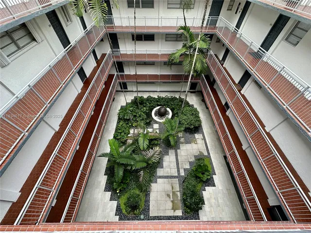 a view of a living room and kitchen