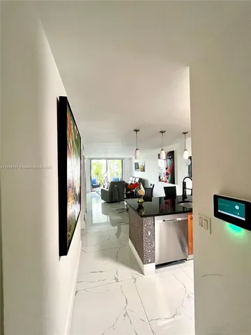 a kitchen with counter top space cabinets and stainless steel appliances