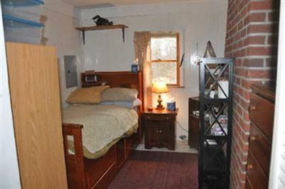 12 Colony Road Dennis Port, MA 02639 - Photo 8 of 12 a bedroom with a bed and a window