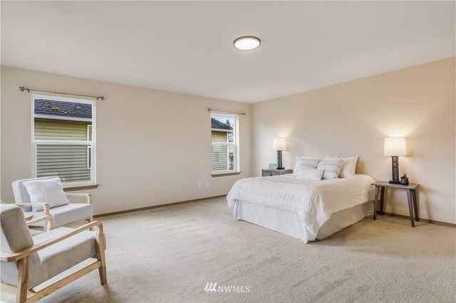 a bed room with a bed and with chair