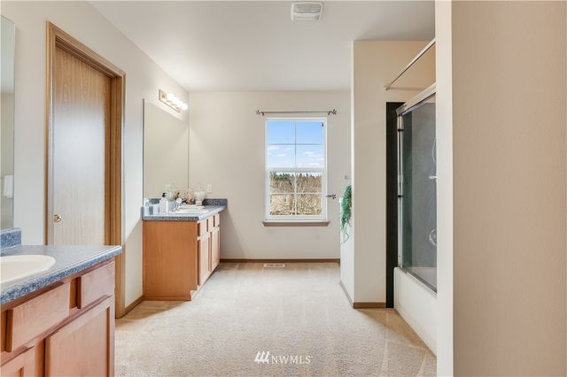 a view of hallway with cabinets