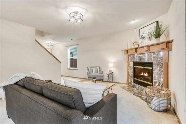 a bedroom with a bed and a fireplace