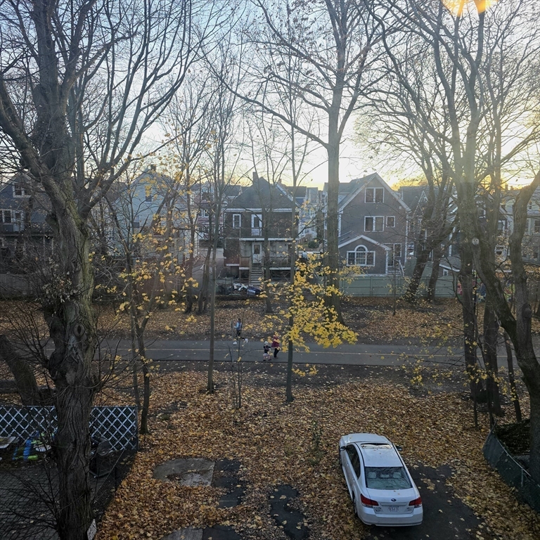 94 Morrison Avenue, Unit 3 Somerville, MA 02144 - Photo 4 of 12 a backyard of a house with barbeque oven