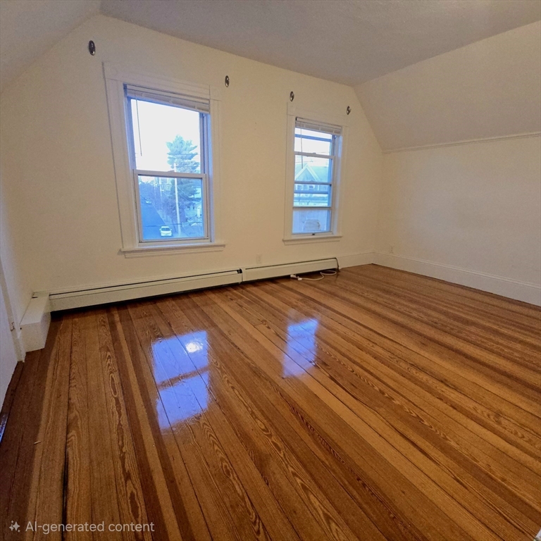 94 Morrison Avenue, Unit 3 Somerville, MA 02144 - Photo 6 of 12 a view of empty room with wooden floor