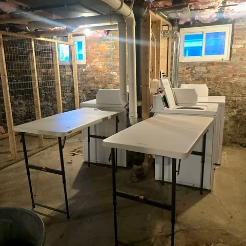 a view of a dining room with furniture and window