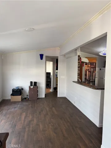 a view of a livingroom with furniture and wooden floor