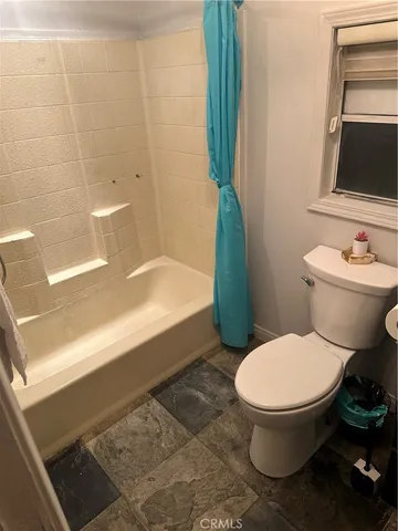 a bathroom with a toilet and a sink