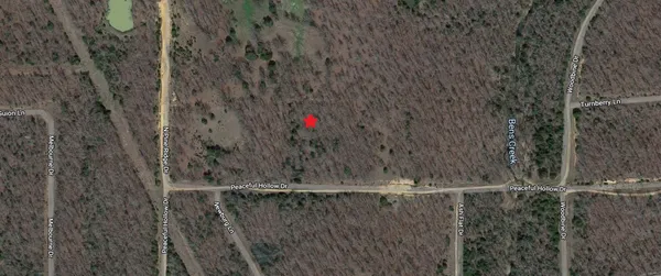 a view of a house with a small yard