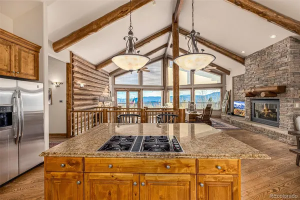 a kitchen with granite countertop a sink and cabinets