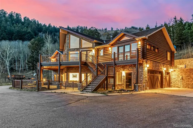a view of a big house with a street