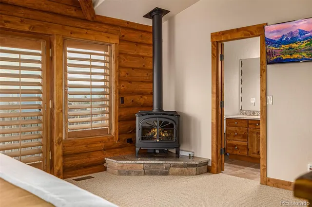 a bathroom with a granite countertop sink a mirror and a shower