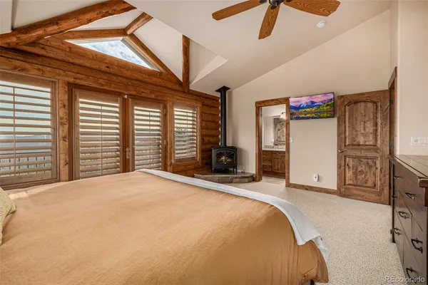 a bathroom with a granite countertop sink a mirror and a shower