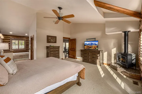 a spacious bathroom with a granite countertop sink mirror and a bathtub