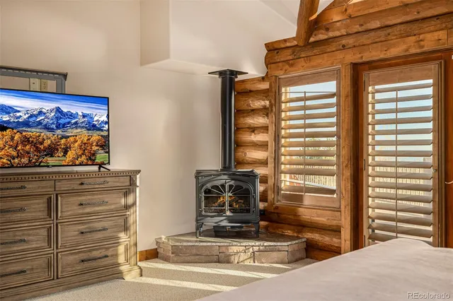 a spacious bathroom with a granite countertop sink mirror and a bathtub