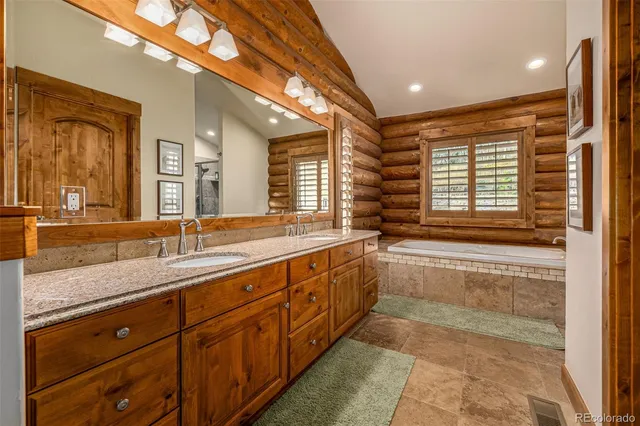 a bathroom with a bathtub and a shower
