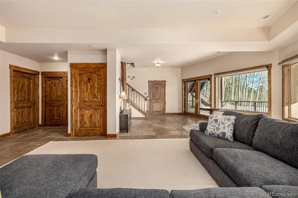 a room with furniture and a ceiling fan
