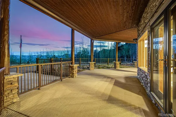 a view of balcony with wooden floor and city view