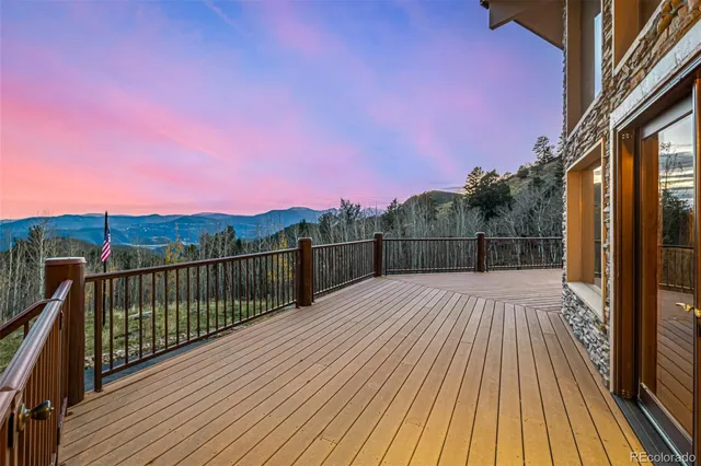 a view of balcony with wooden floor and city view