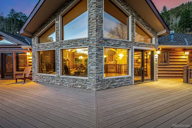 a view of a terrace with trees in the background