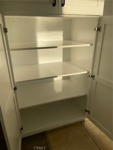 a white stove top oven sitting inside of a kitchen