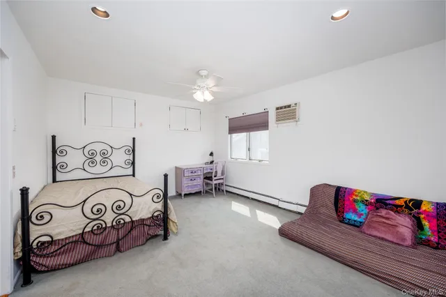 a view of a house with backyard and a trees