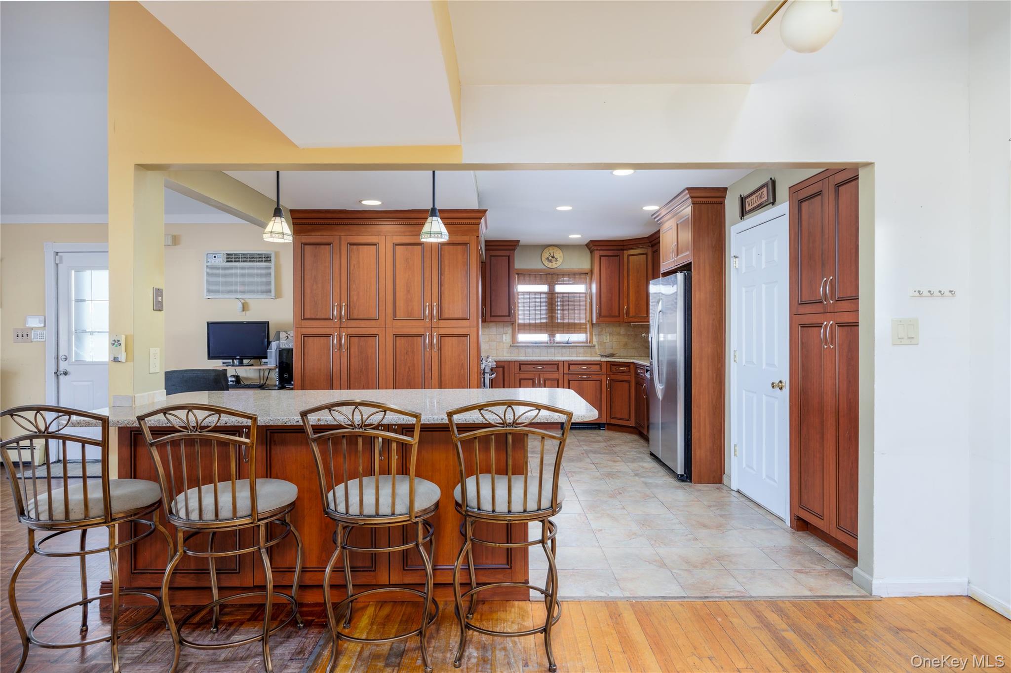 3418 Oceanside Road Oceanside, NY 11572 - Photo 3 of 29 a kitchen with a table and chairs