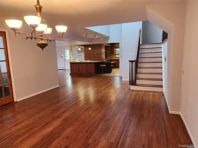 a view of a livingroom with wooden floor