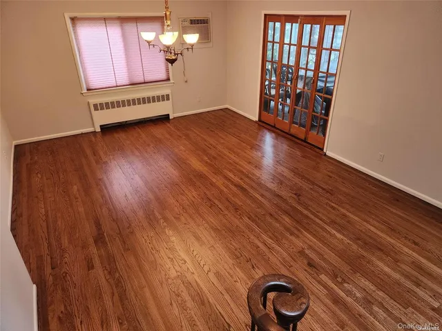 a view of a livingroom with wooden floor