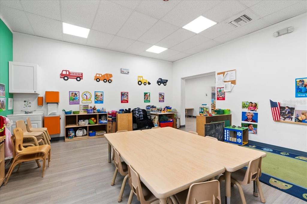 1938 Northeast Waldo Road Gainesville, FL 32609 - Photo 11 of 64 a view of a dining room with furniture and wooden floor